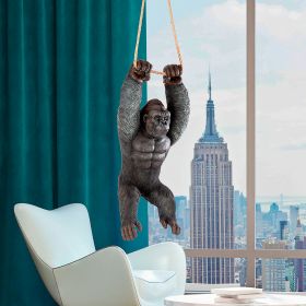 GORILLA HANGING FROM ROPE